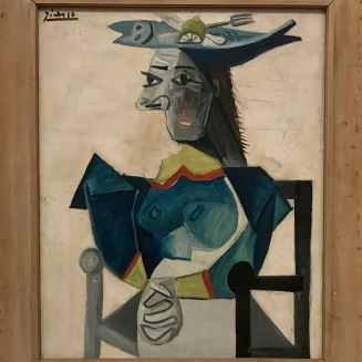 Femme assise au chapeau en forme de poisson. Pablo Picasso. 1942.