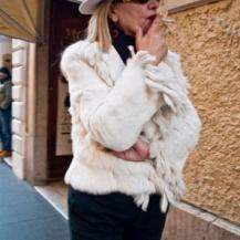 Fur coat, a hat and the other favorite Italian accessory - the cigarette.