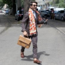 Patterned suit, floral scarf, rolled pant, man purse, loafers. Photo: clairechic.com