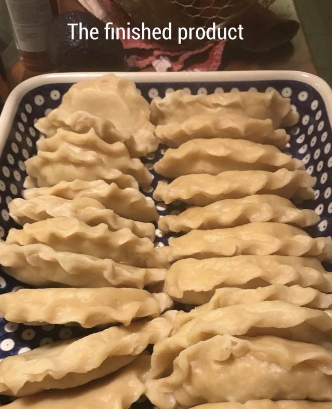 A plate filled with pierogi.